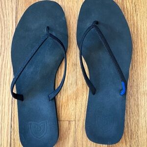 Rothy's Black flip flops—- lightly worn but great condition